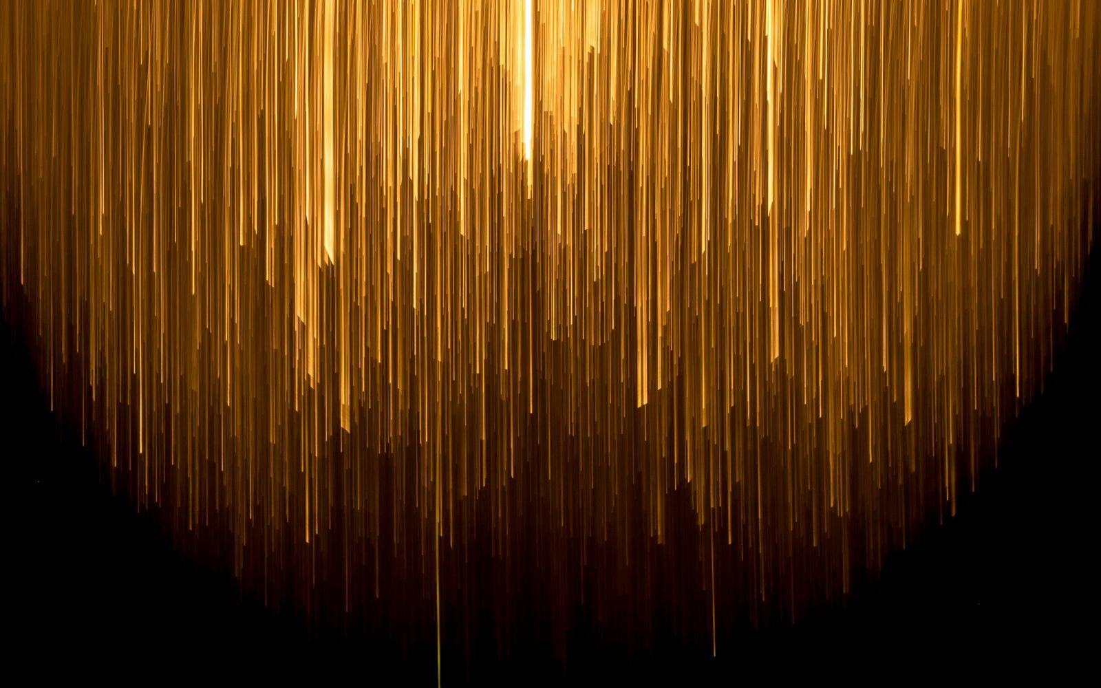Gold lines of light on black