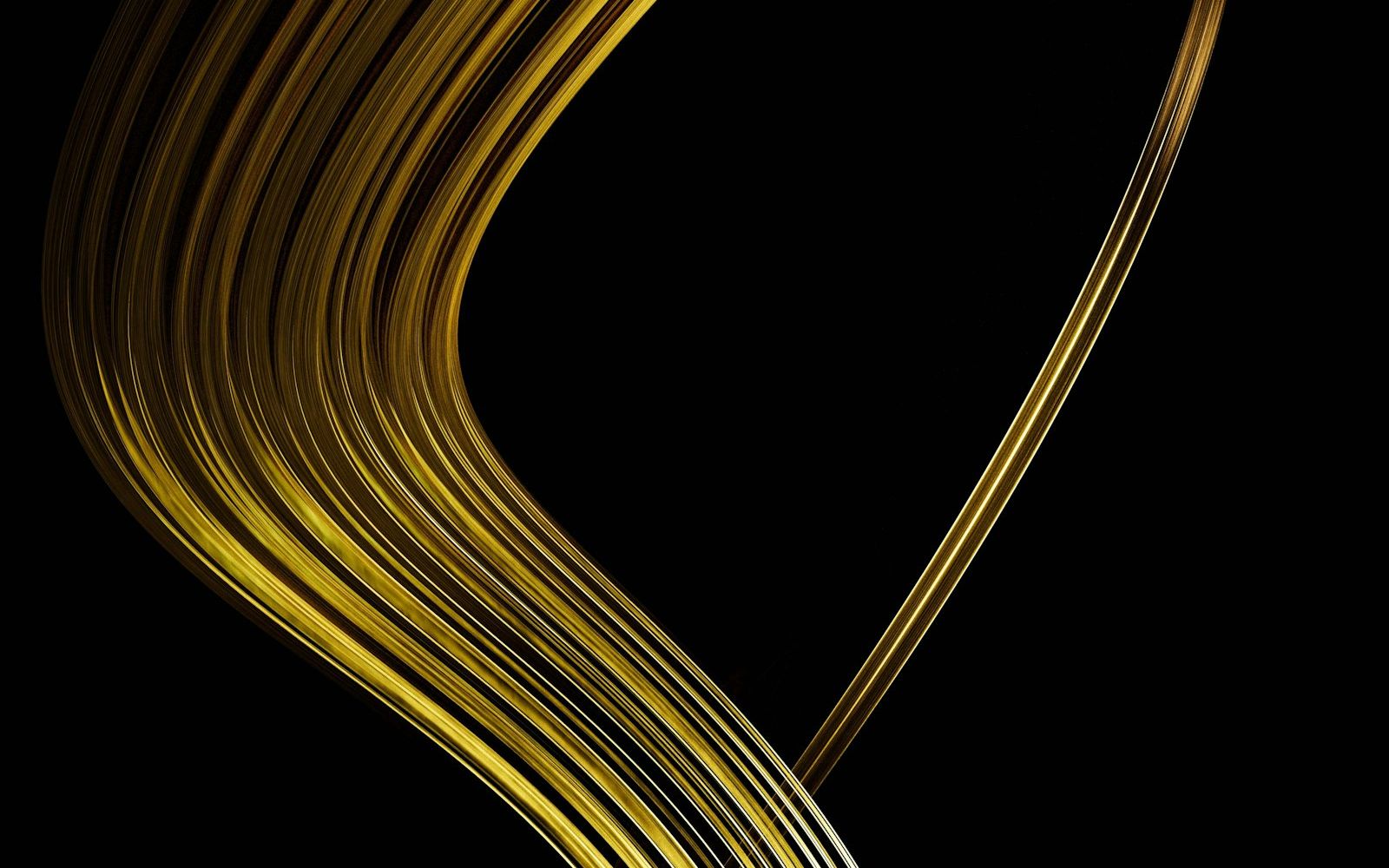 Golden ribbons flowing on a dark background